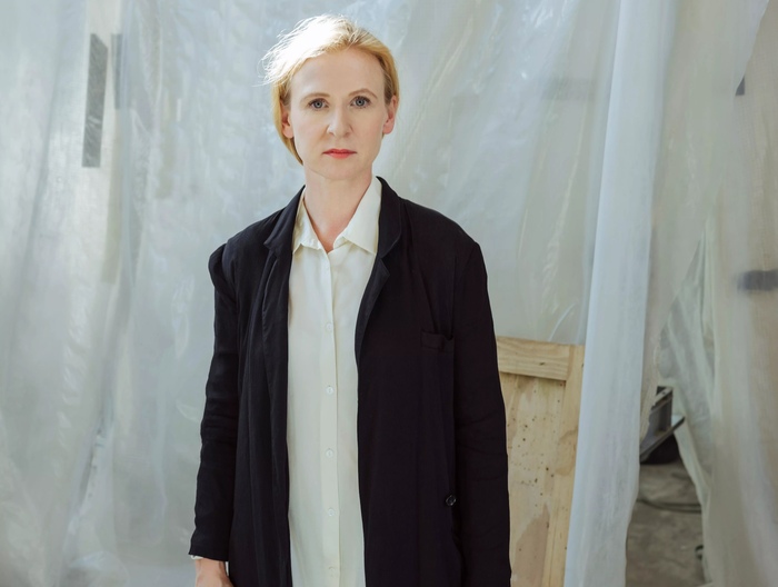 Alicja Kwade stands in a photo by Doro Zinn