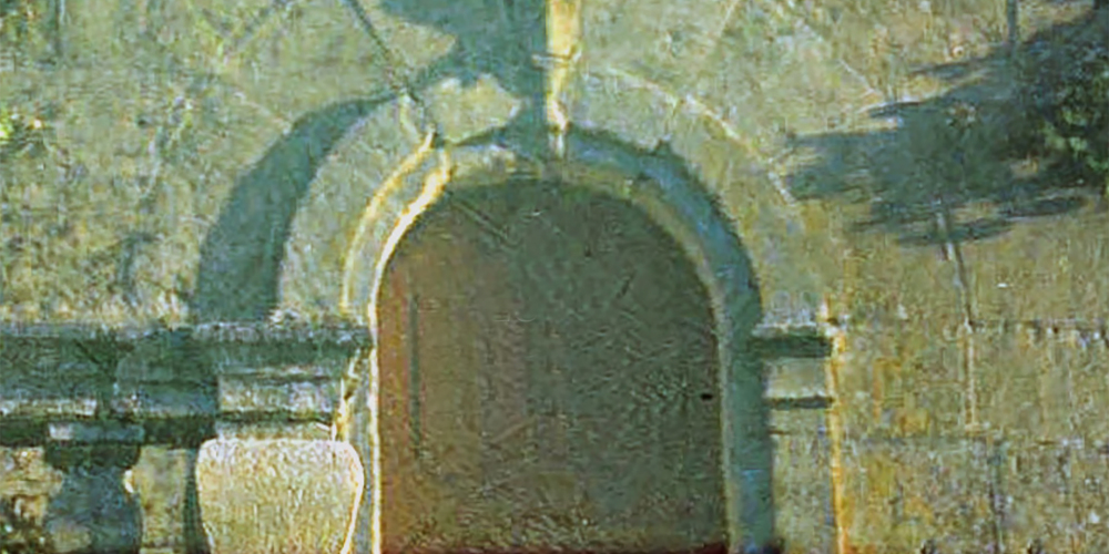 Stone archway above a building entrance.